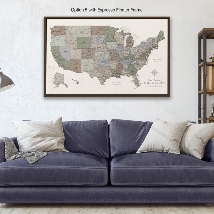 a living room with a blue couch and a map on the wall
