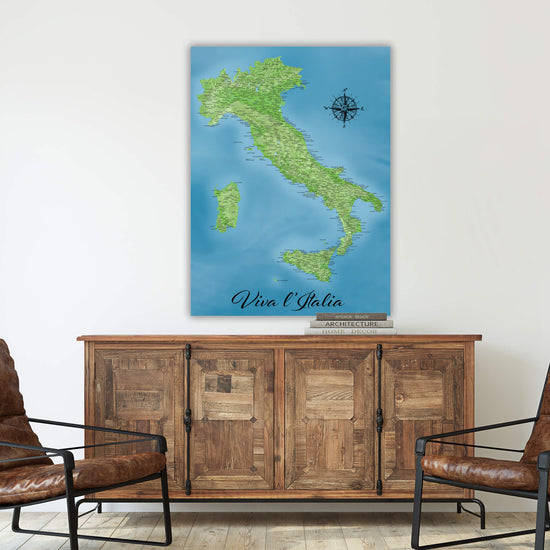 a large map of Italy hanging on a wall above a wooden cabinet.