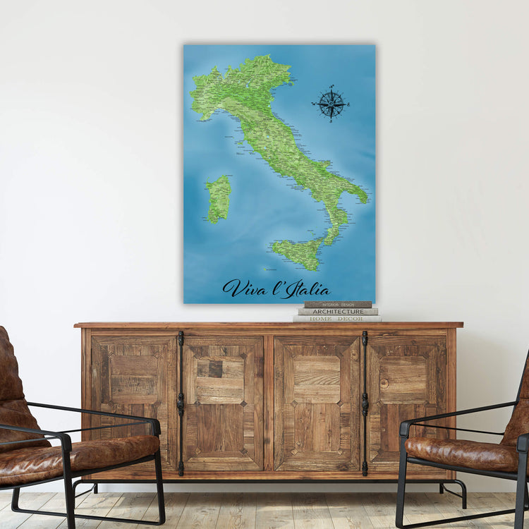 a large map of Italy hanging on a wall above a wooden cabinet.