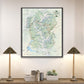 a large framed map of the Yellowstone National Park region hanging on a wall, with two lamps on a shelf below it.