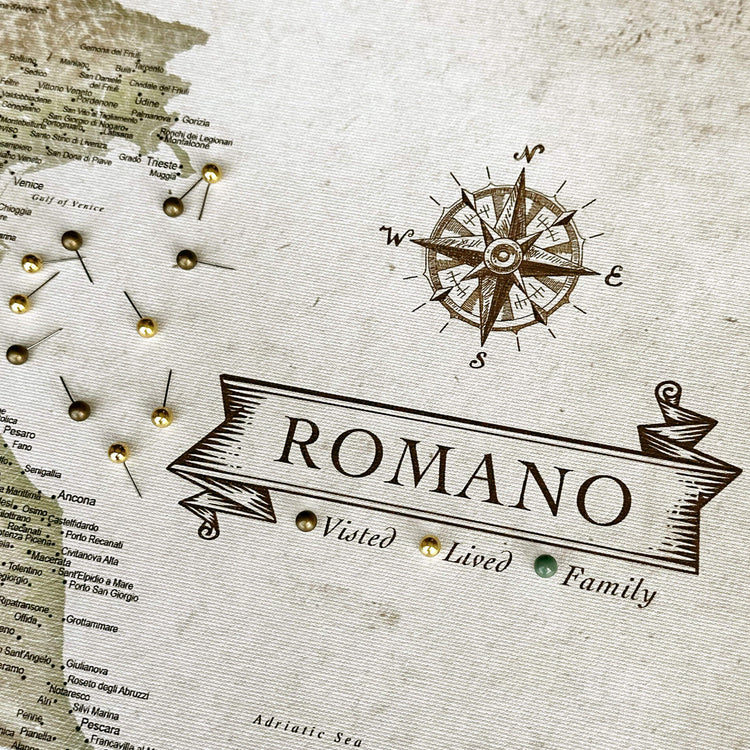 a map with the word "ROMANO" written on it, along with a compass rose and a banner displaying the text "ROMANO Visited | Lived | Family".