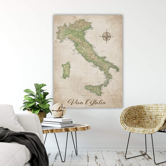a wall-mounted map of Italy, with a wicker chair and a small table in the foreground.