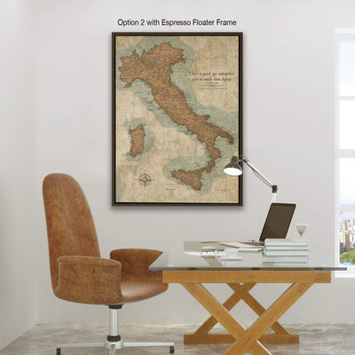 a workspace with a desk, chair, and a laptop. Above the desk, there is a framed map of Italy hanging on the wall.
