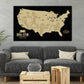 a large black and white map of the United States with football players depicted on it, hanging on a wall above a gray couch and a wooden coffee table.