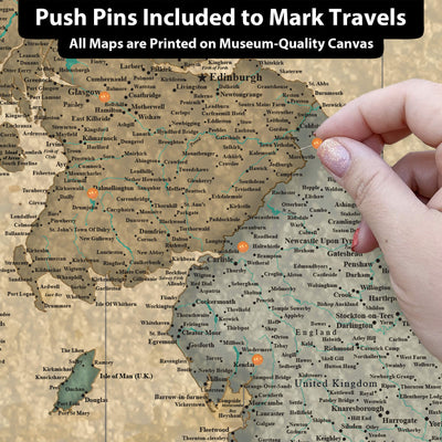 a person pointing at a map with pins on it