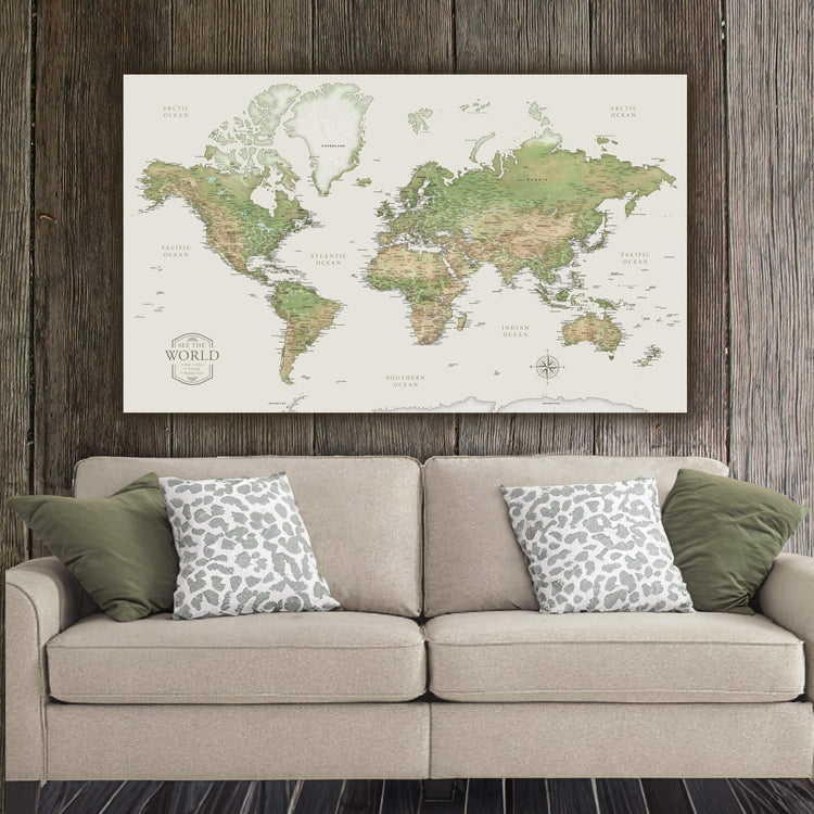 a living room with a couch and a map on the wall