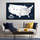 a large map of the United States with various locations marked, and a cozy living room setting with a couch, coffee table, and decorative items.