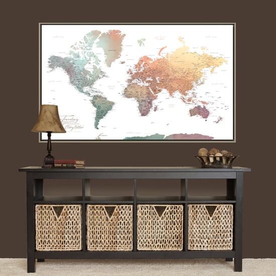 a large world map displayed on a wall above a black console table with storage baskets below it.