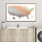 a large map of the United States hanging on a wall above a wooden cabinet with a sink.