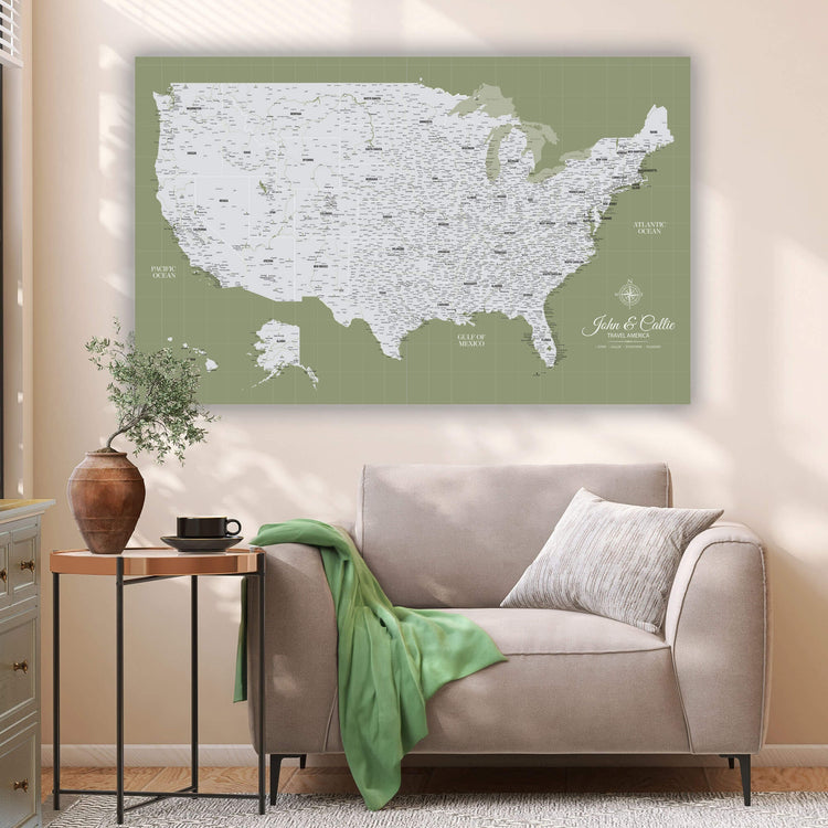 a large map of the United States on the wall, with a cozy living room setting below it.
