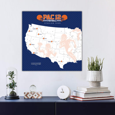 a wall-mounted map of the United States with various locations marked, including a football stadium. Below the map, there is a collection of decorative items such as a glass dome, a clock, and a stack of books.