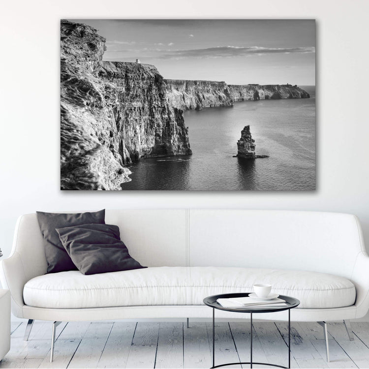 a black and white photo of a boat in the ocean