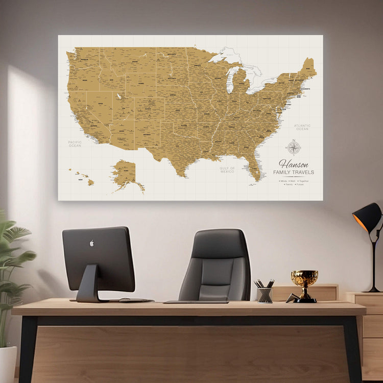 a map of the united states on a wall above a desk