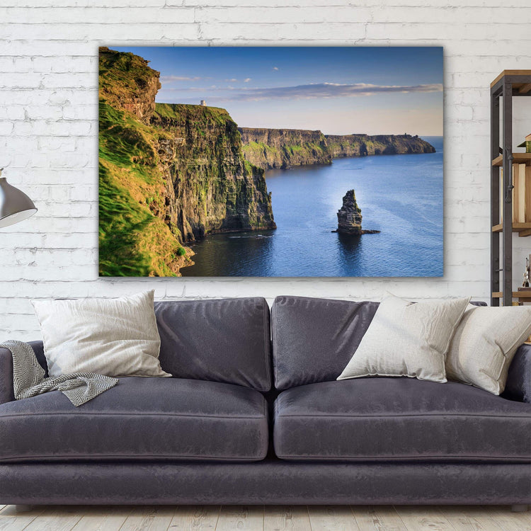 a living room with a couch and a painting on the wall