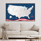 a large, detailed map of the United States with a blue background and red and white stripes, hanging on a wall above a white couch.