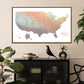 a large, colorful map of the United States hanging on a wall above a black cabinet. The map is surrounded by various decorative items, including a bird figurine, a bowl, and a vase.