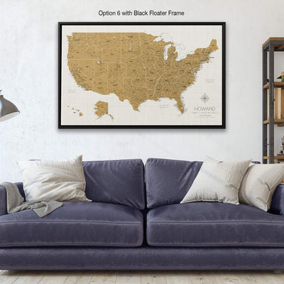 a living room with a blue couch and a map on the wall