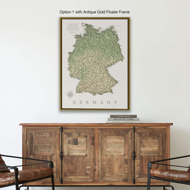 a framed map of Germany hanging on a wall above a wooden cabinet.