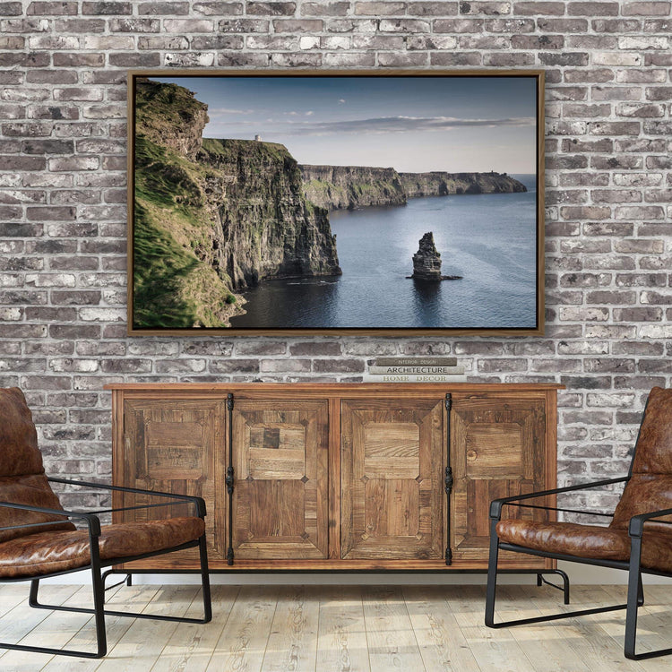 a living room with a brick wall and a painting on the wall
