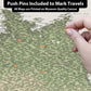 A hand is pinning a push pin to a map of the Baltic Sea region, which is printed on a museum-quality canvas.