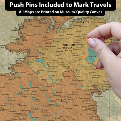 a person pointing to a map with pins on it