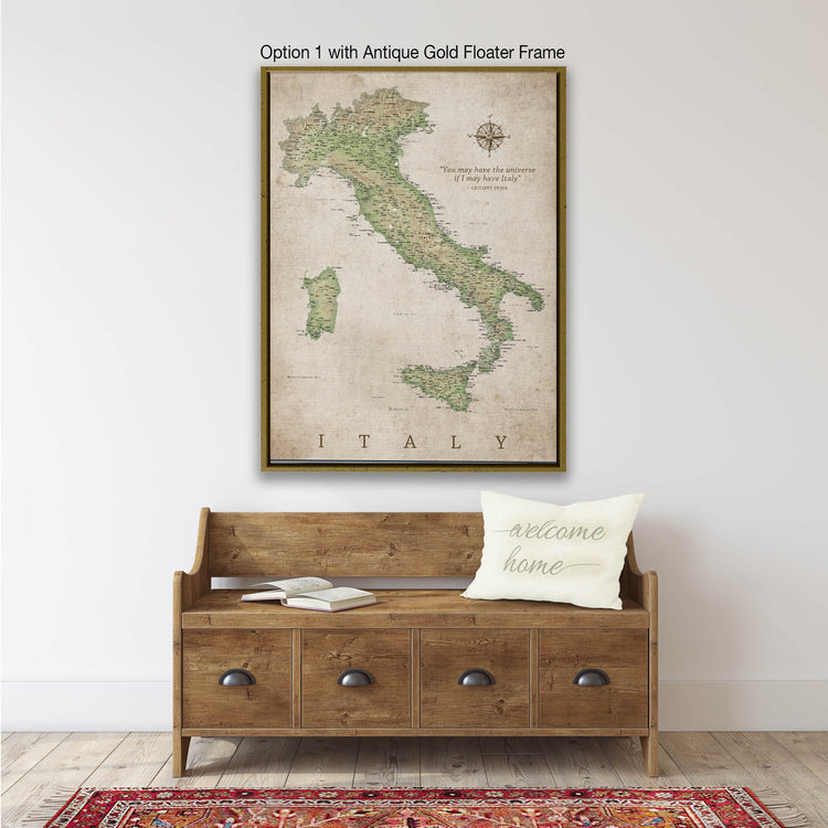 a large framed map of Italy hanging on a wall above a wooden bench with a "welcome home" pillow.