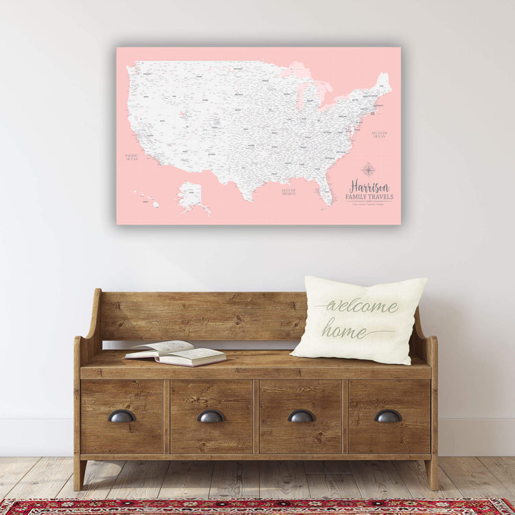 a wooden bench with a white pillow and a map of the United States hanging above it.