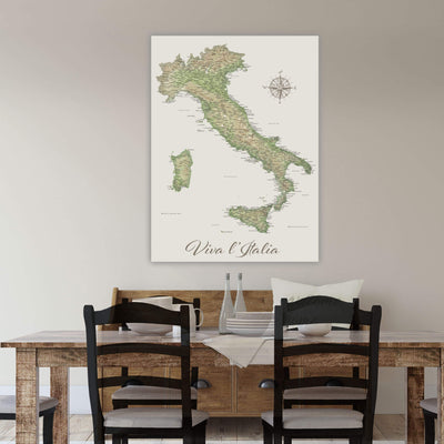 a large map of Italy hanging on a wall above a wooden dining table with four chairs.