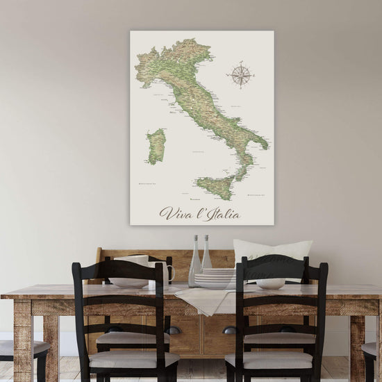 a large map of Italy hanging on a wall above a wooden dining table with four chairs.