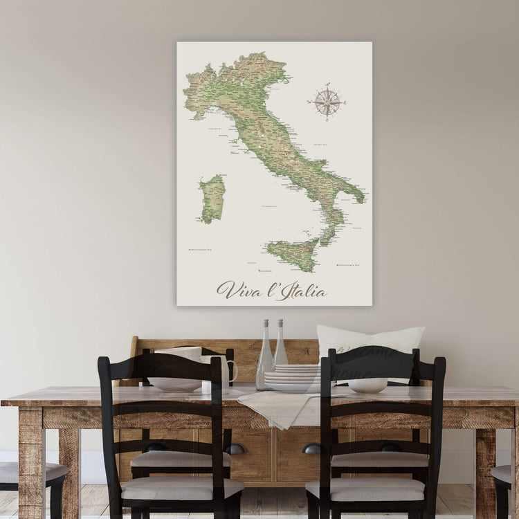 a large map of Italy hanging on a wall above a wooden dining table with four chairs.