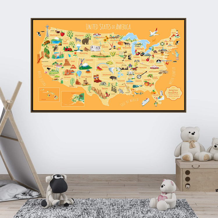 a large, colorful map of the United States, with various landmarks and locations marked on it. The map is displayed on a wall, and there are some stuffed animals, including two teddy bears, placed in the foreground.