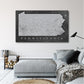 a living room with a couch and a painting on the wall