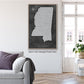 a living room with a couch and a painting on the wall