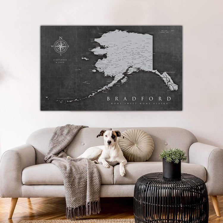 a dog sitting on a couch in a living room